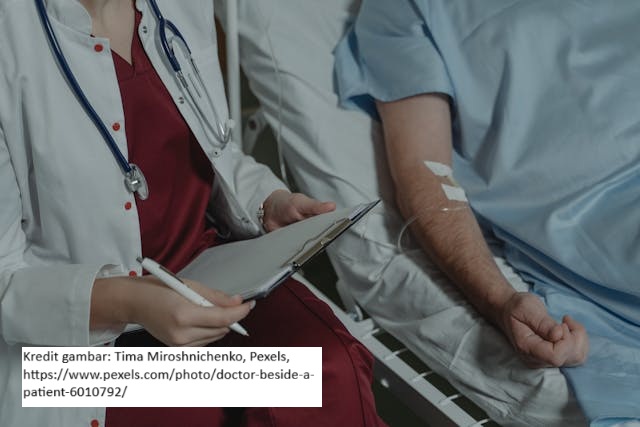 Doctor Beside a Patient